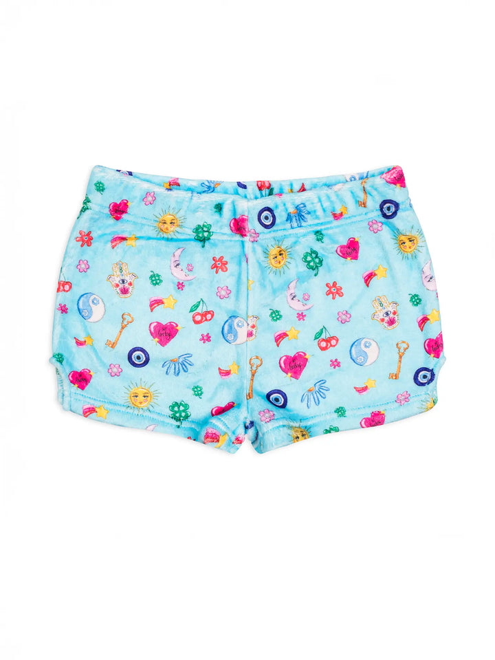 Light blue shorts with colorful lucky charm print on a white background