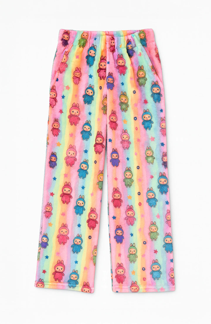 Colorful loungewear pants with fuzzy doll character pattern on a rainbow background