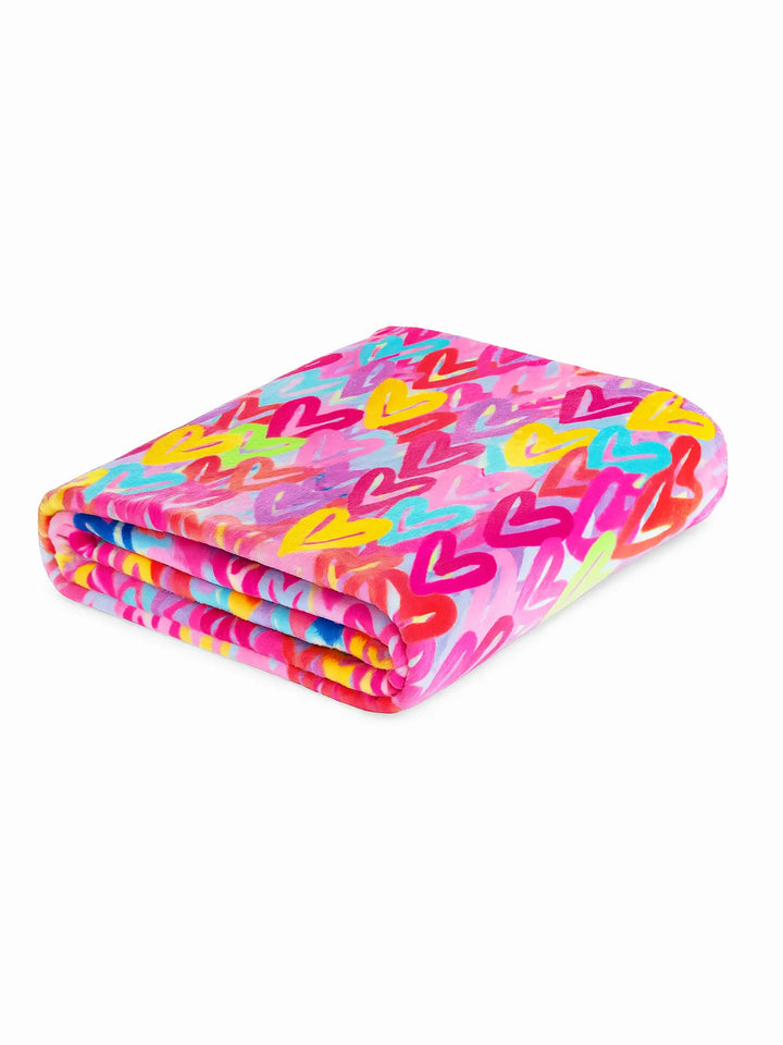 Colorful heart-patterned blanket on a white background