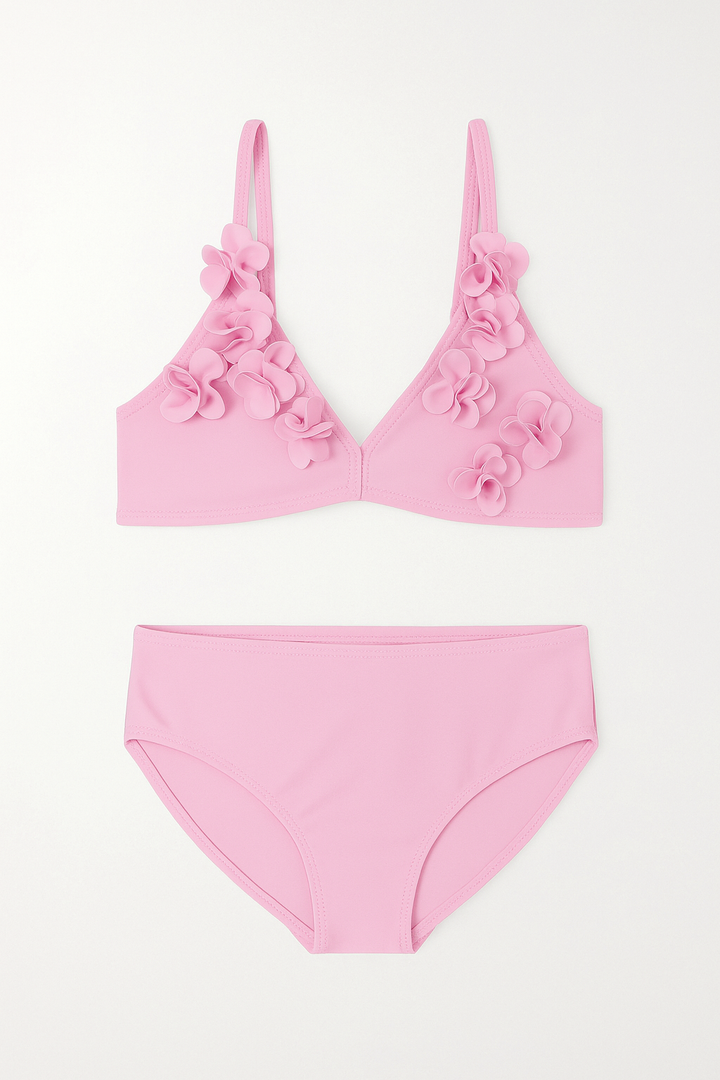 Pink bikini set with floral details on a white background