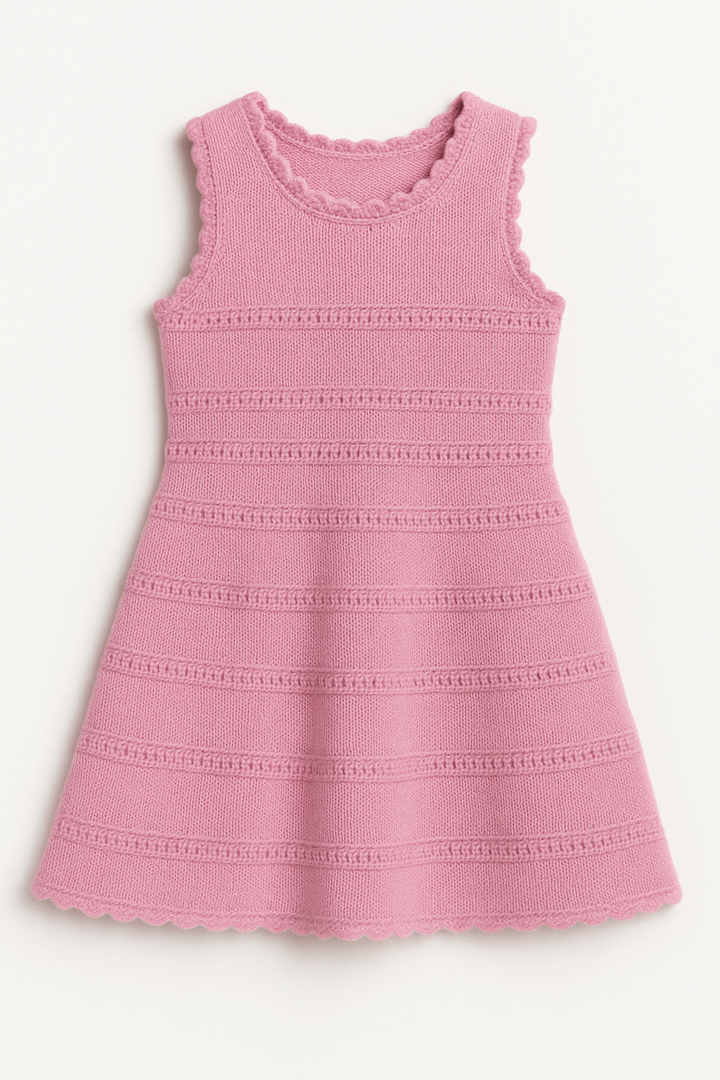 Pink crochet knit dress with textured pattern on a white background