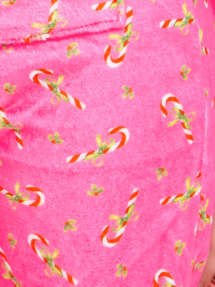Pink fabric with candy cane and bow pattern