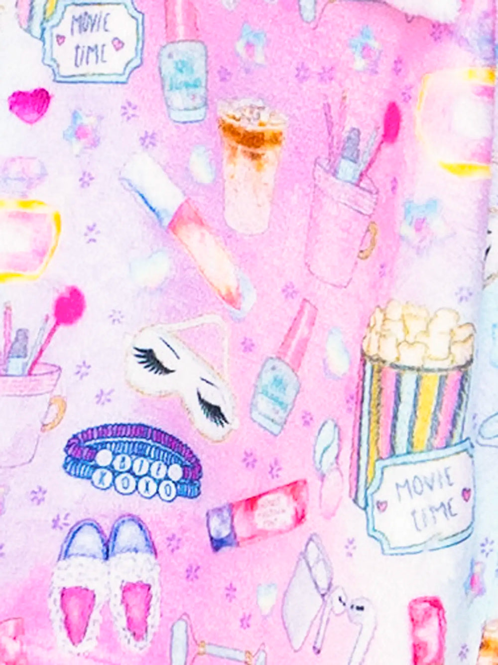 Pink pattern with movie-themed items including popcorn, makeup, and ice cream.